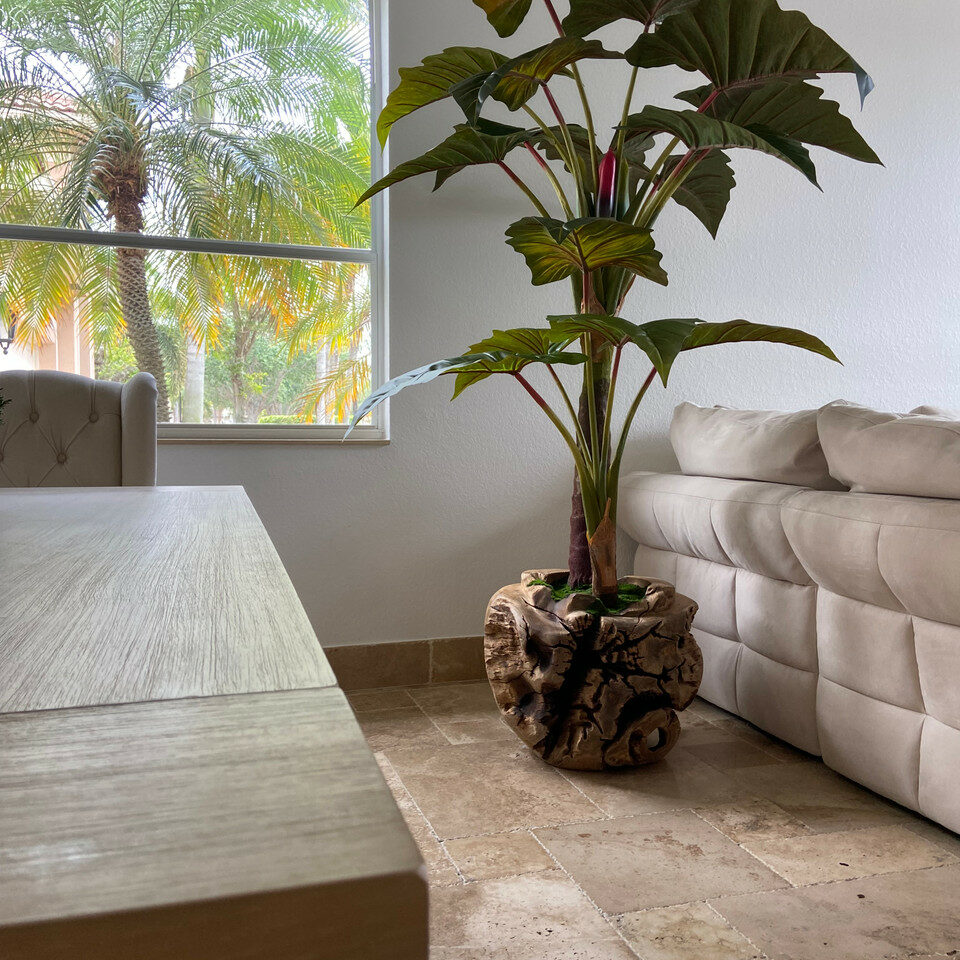 Largealer artificial plant in bowl